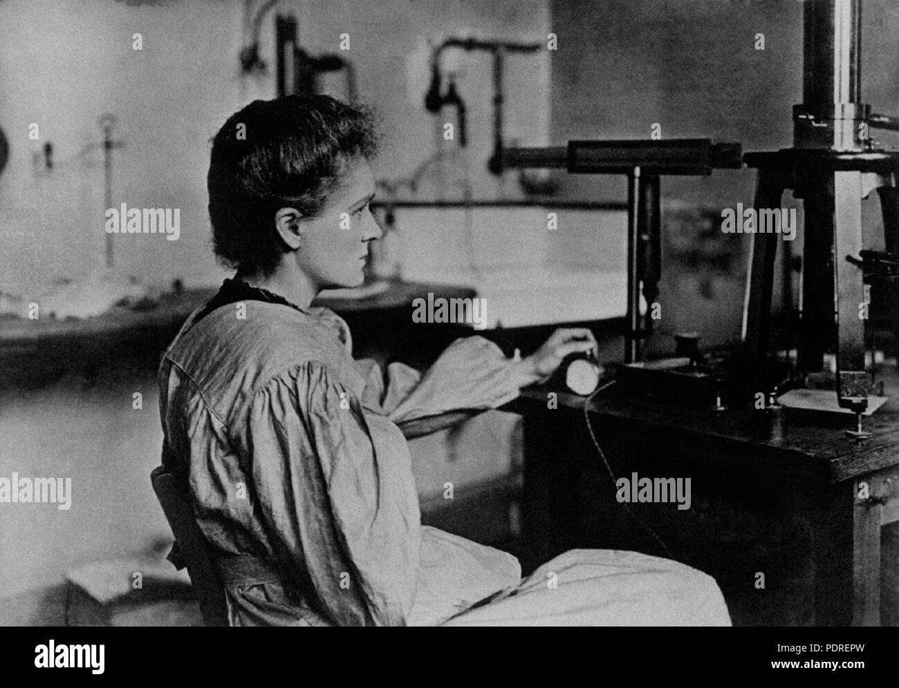 Polish-born Russian and French chemist and physicist Marie Curie (Maria Sklodowska) sitting in her laboratory. 1900s *** Local Caption ***   17 Marie Curie in her laboratory Stock Photo