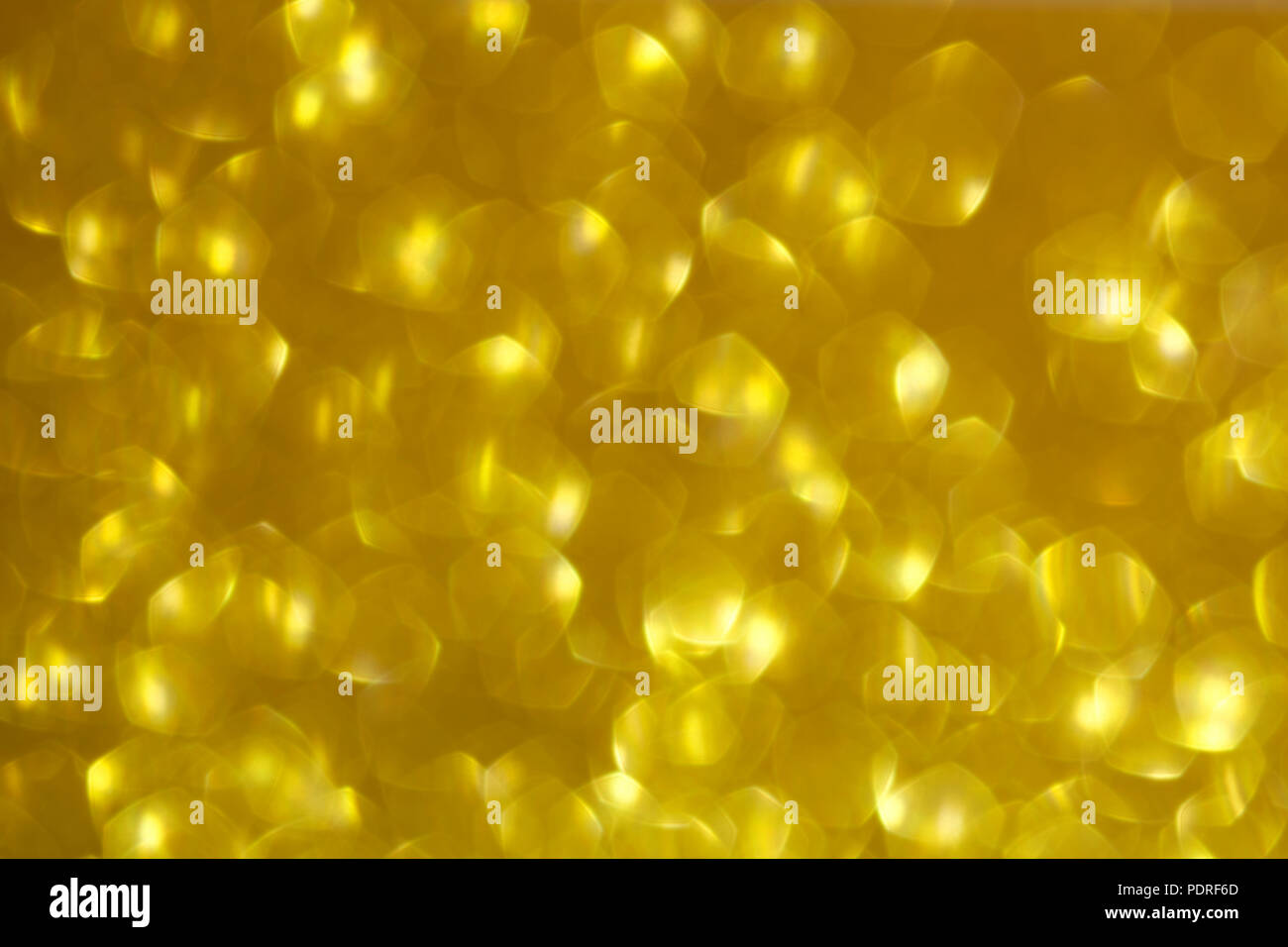 Shiny gold abstract background with a bokeh effect Stock Photo - Alamy