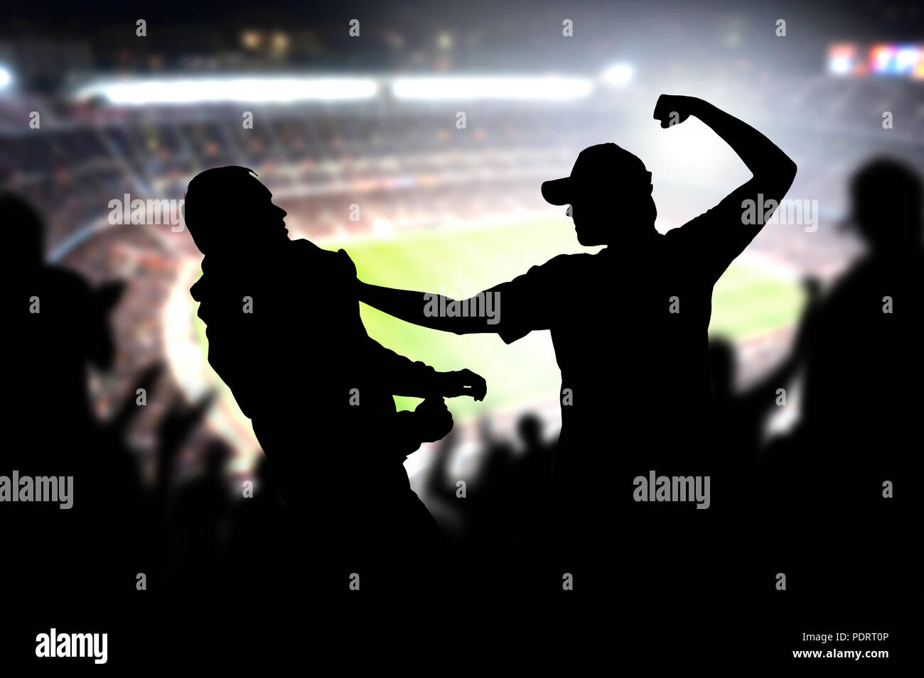 Fight in a football game crowd. Angry man hitting another spectator in soccer match audience. Violent argument between two fans of different teams. Stock Photo