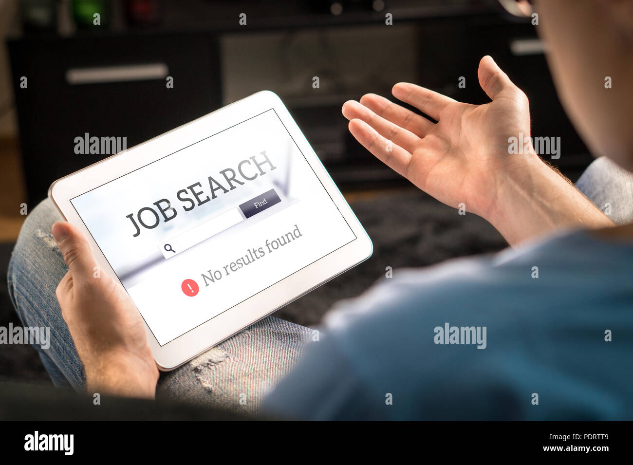 Unemployment and job search problem. Unhappy and frustrated man can't find work with tablet. No results found in online search engine. Stock Photo