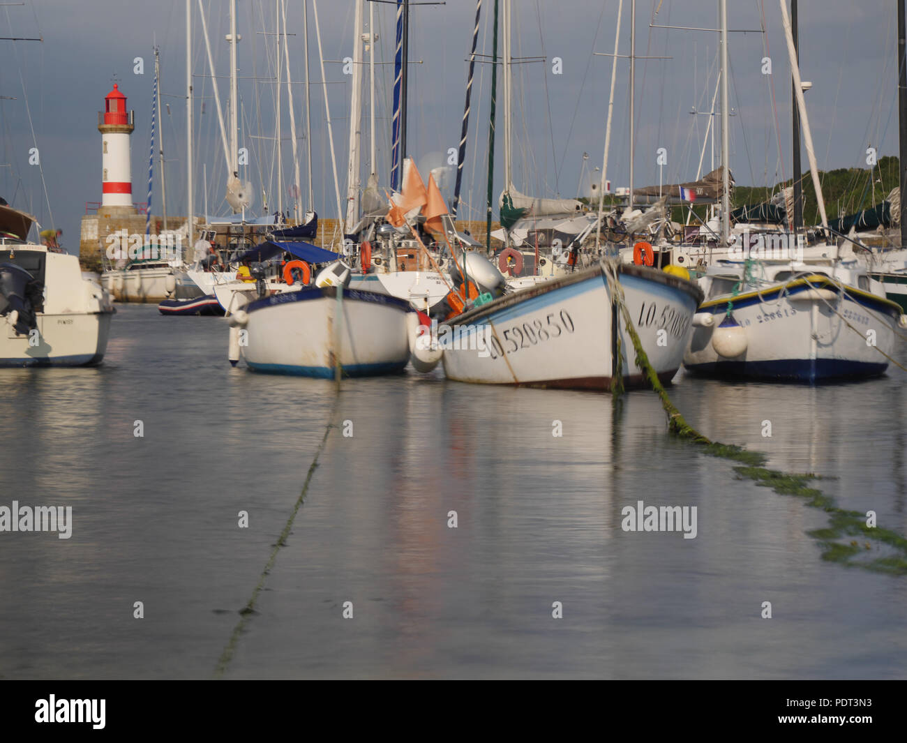 Old boats in the harbor of Ile de Groix, France Stock Photo