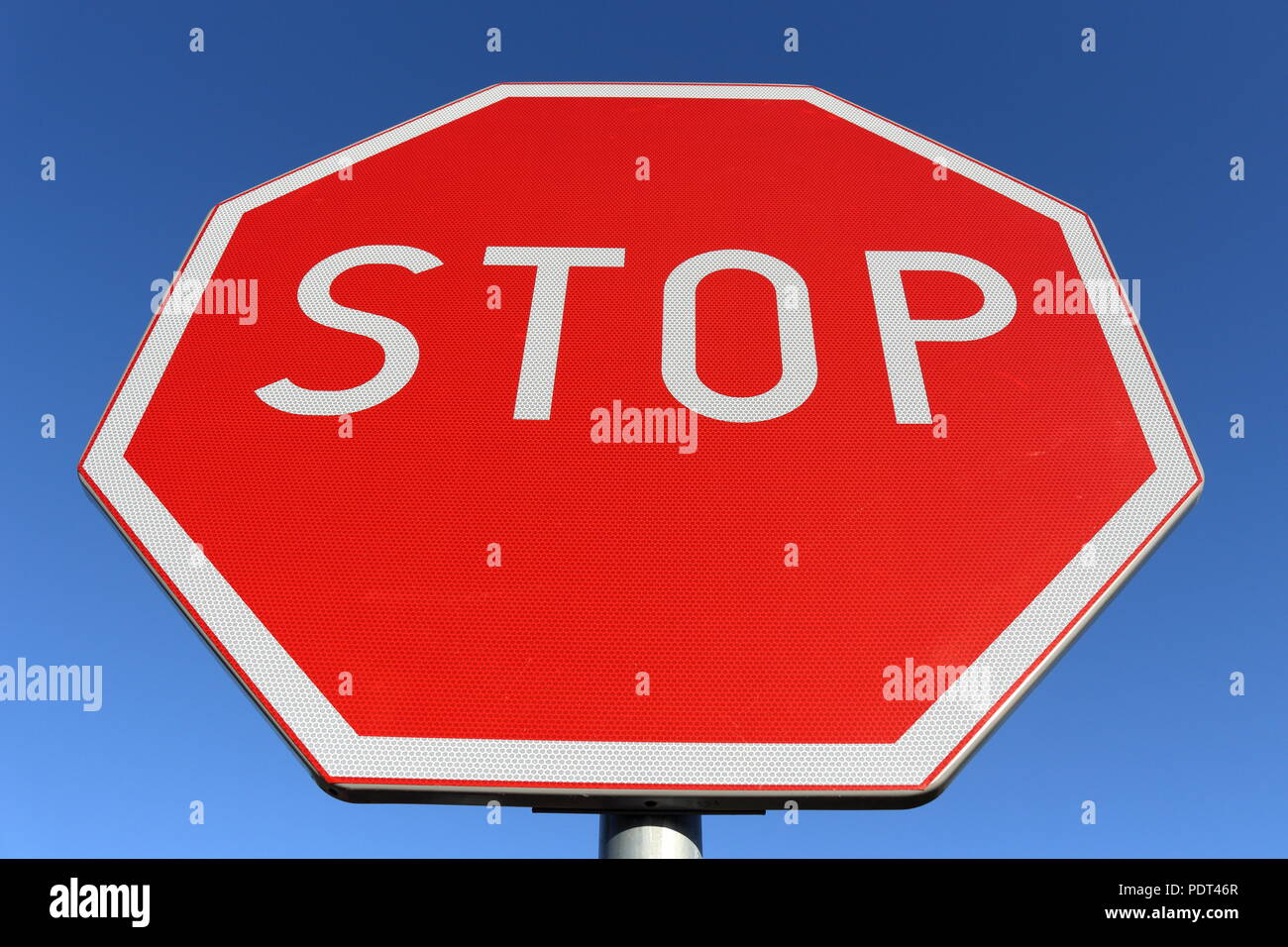 Stop road sign with clear blue sky background Stock Photo
