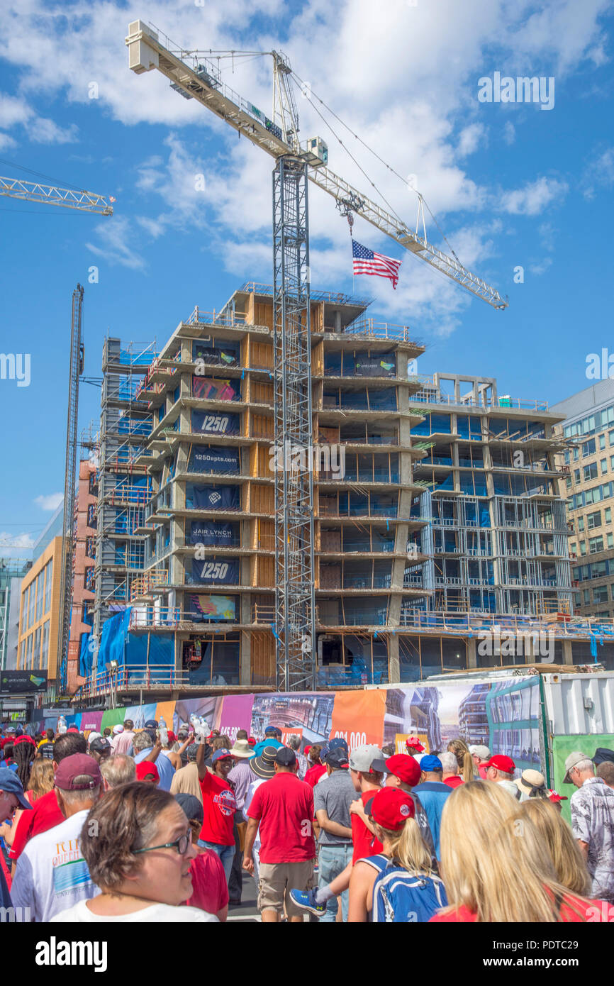 Baseball fans walk on Half St SE past new construction near Nationals