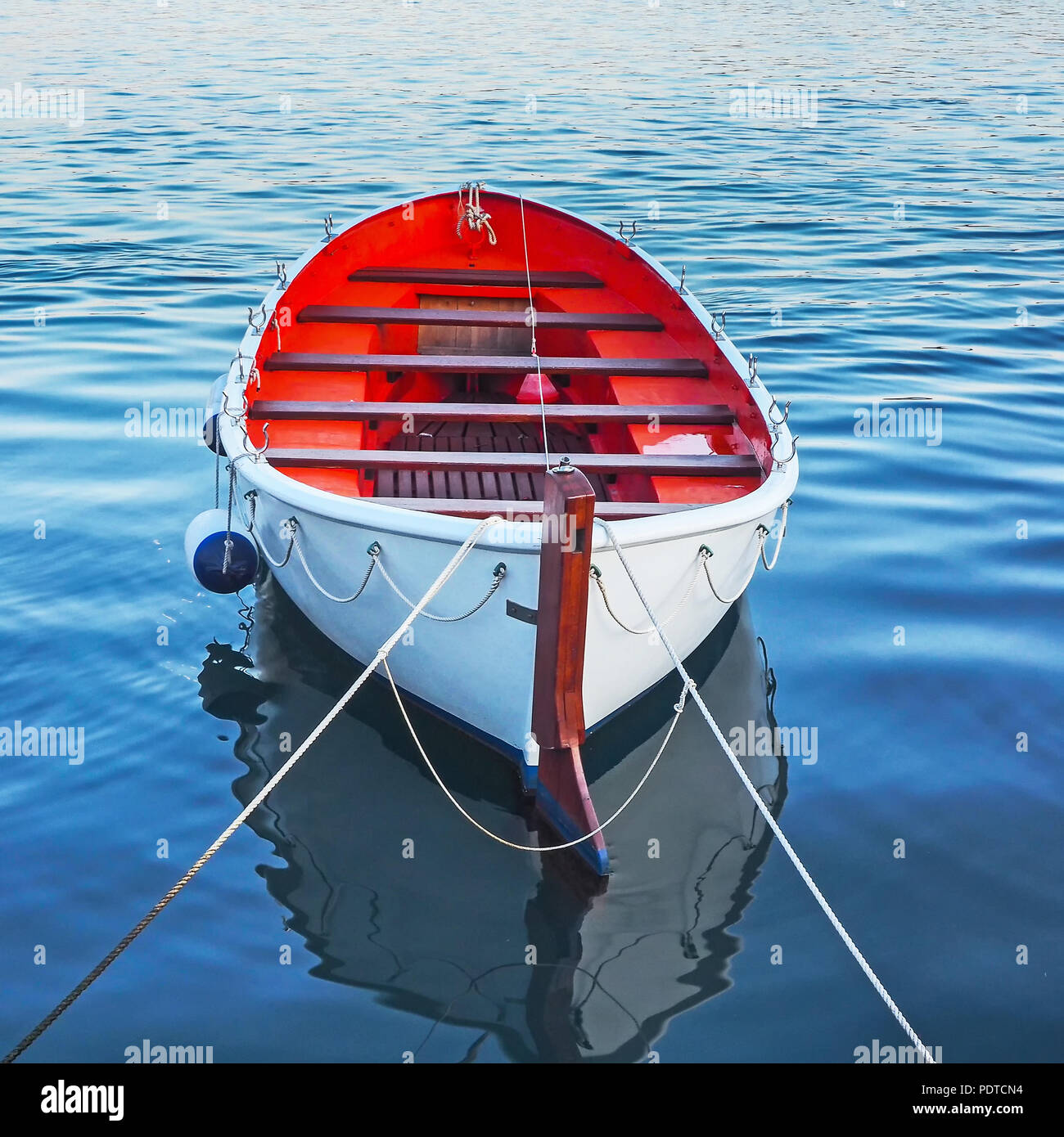 Empty rowboat in the water Stock Photo Alamy