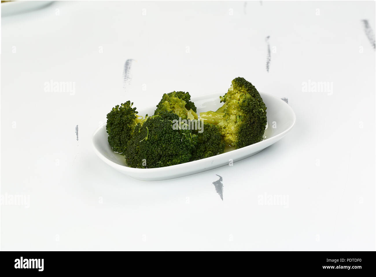 Healthy Green Broccoli in plate Stock Photo