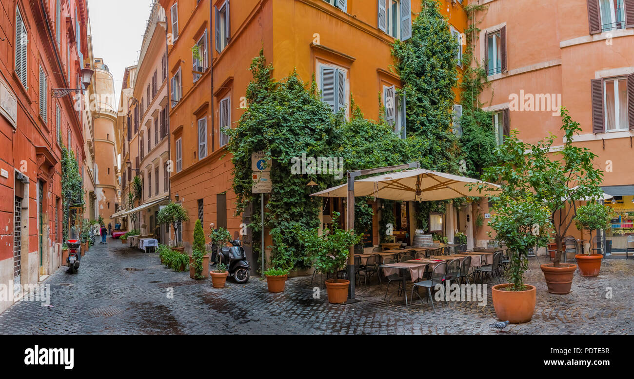 Italian Centro Rome Rome, Italy - October 11, 2016: Narrow street and an open air cafe in ...
