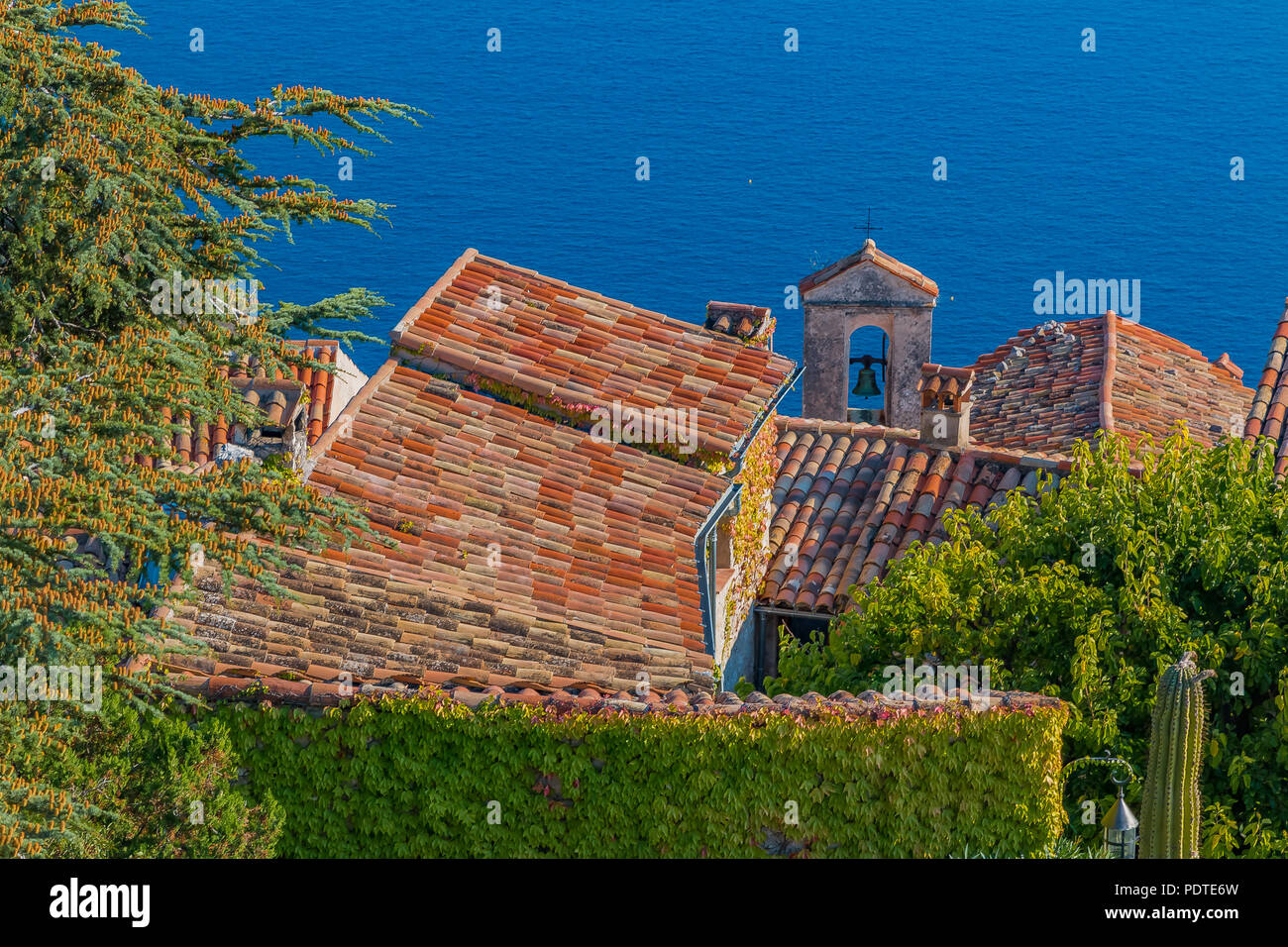 Scenic view of the medieval rooftops and bell tower from the top of the town of Eze village on the French Riviera Stock Photo