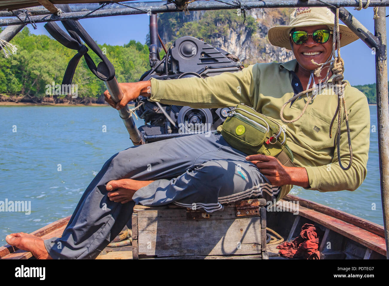 Smiling longtail boat captain in Thailand Stock Photo - Alamy