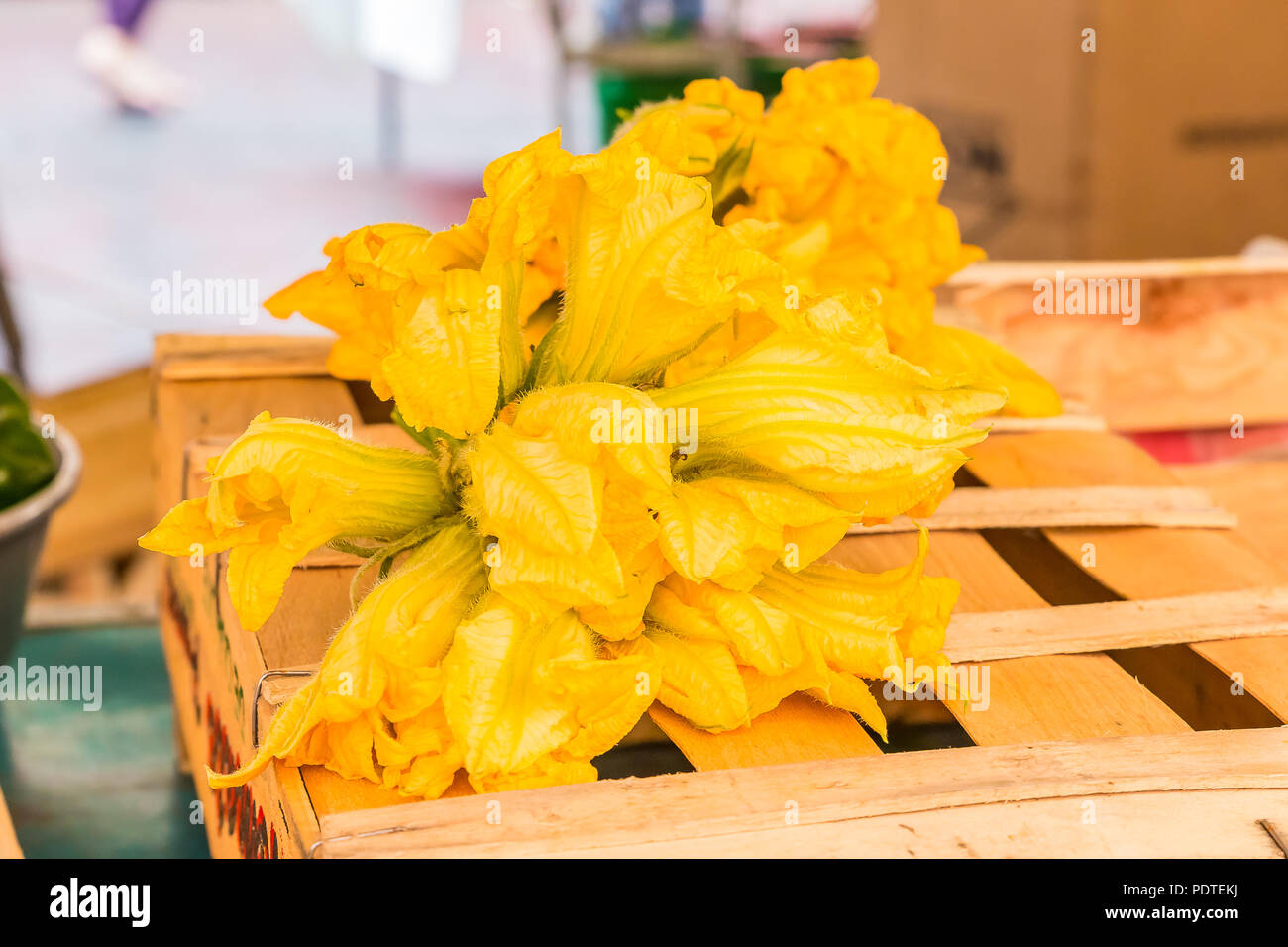 Traditional delicacy from South of France - courgette or zucchini flowers at the market on Cours Saleya in in the Old Town, Vieille Ville in Nice, Fre Stock Photo