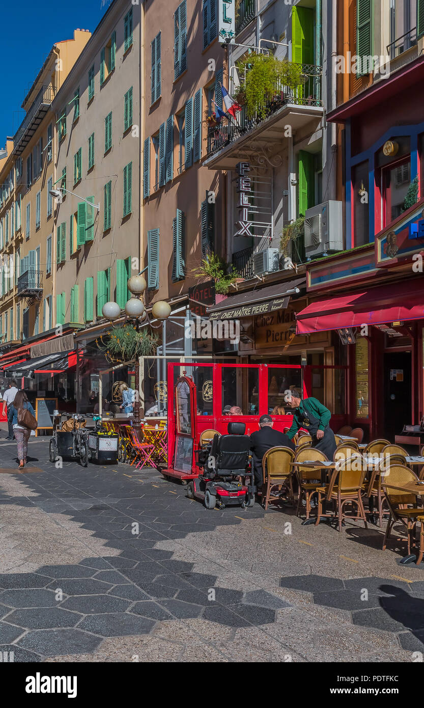 Nice, France - April 19, 2016: Street cafes and mediterranean house