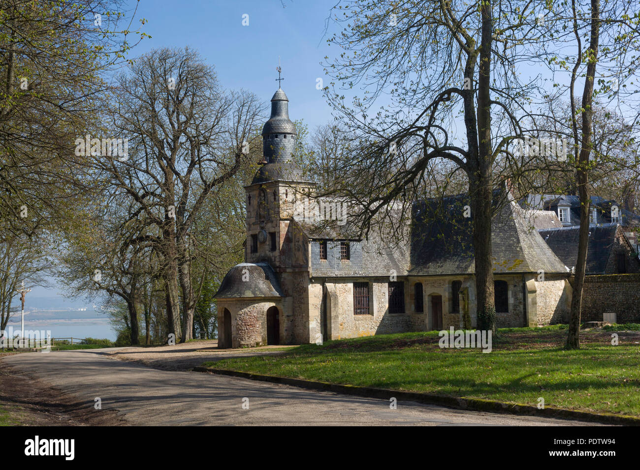 The chapel of Notre Dame de Grace in the Spring sunshine, high on the Cote de Grace above Honfleur, Normandy, France Stock Photo