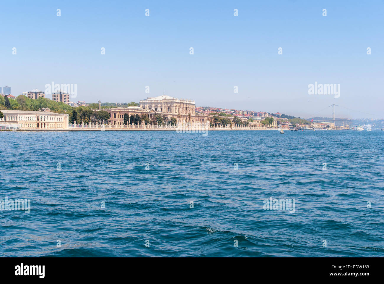 Dolmabahce Palace view from Bosphorus strait in Istanbul Turkey from ferry on a sunny summer day Stock Photo