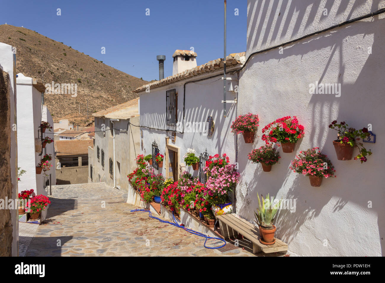 Pretty White Washed Spanish Houses in Small Rural Town of Oria in Andalucia Spain Stock Photo