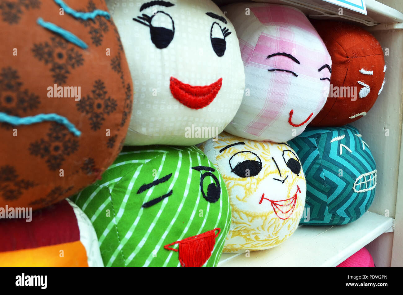 Different human expressions and emotions portrayed on pillows Stock Photo