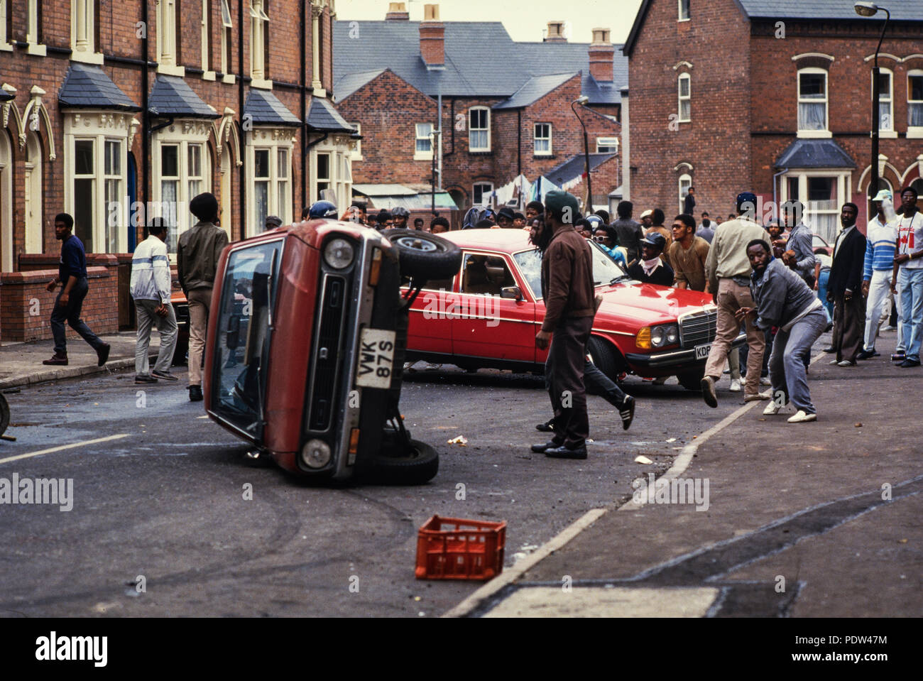 Handsworth Riots, Birmingham, Engalnd September 1985 The second Handsworth riots took place in the Handsworth district of Birmingham, West Midlands, from 9 to 11 September 1985. The riots were reportedly sparked by the arrest of a man near the Acapulco Cafe, Lozells and a police raid on the Villa Cross public house in the same area. Hundreds of people attacked police and property, looting and smashing, even setting off fire bombs.  Two brothers (Kassamali Moledina, 38, and his 44-year-old brother Amirali)[1] were burnt to death in the post office that they ran.[2] Two other people were unaccou Stock Photo