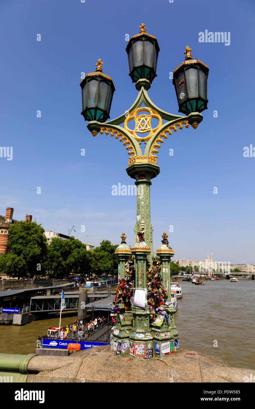 Westminster Bridge light with mementoes to suicide victims, over the River Thames, London, England Stock Photo