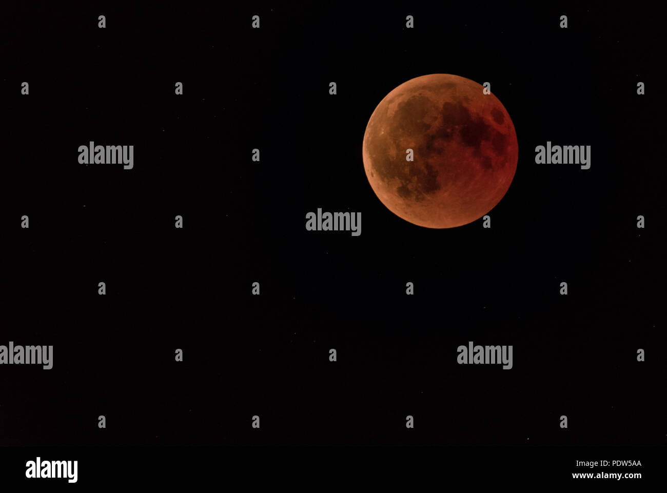 a full moon or blood moon during a complete lunar eclipse in a black ...