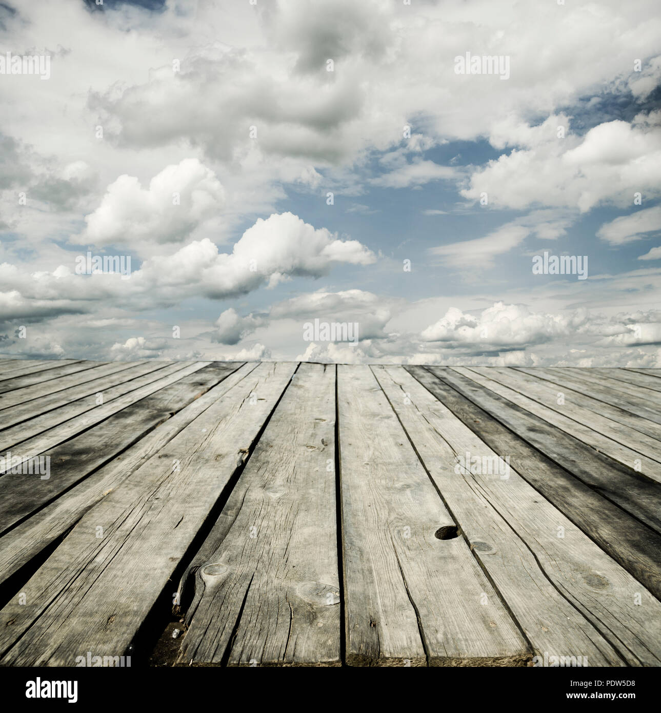 Rustic wooden planks and cloudy sky background design Stock Photo - Alamy