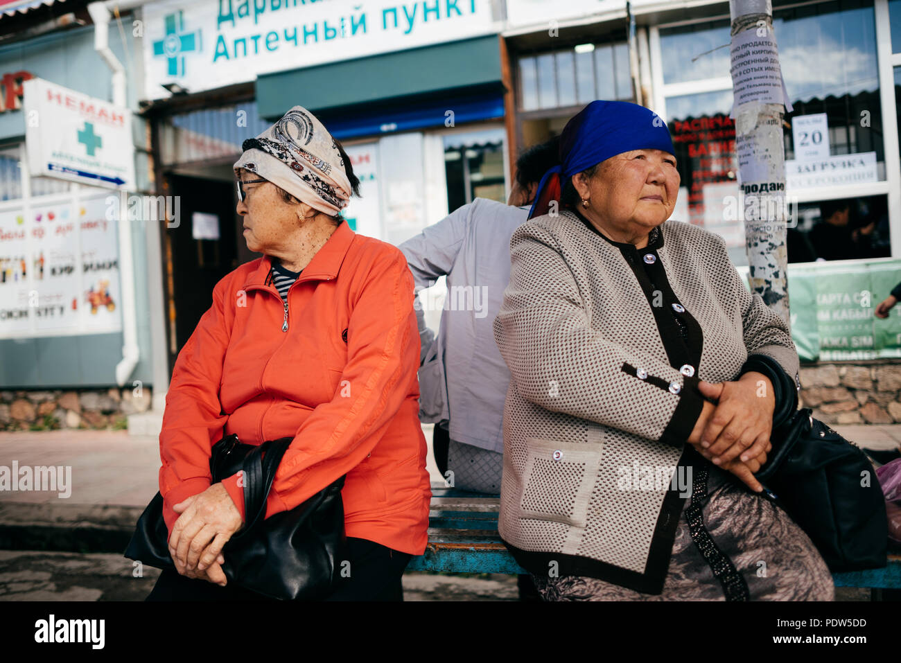 Kyrgyz woman on the streets of Karakol, Kyrgyzstan Stock Photo