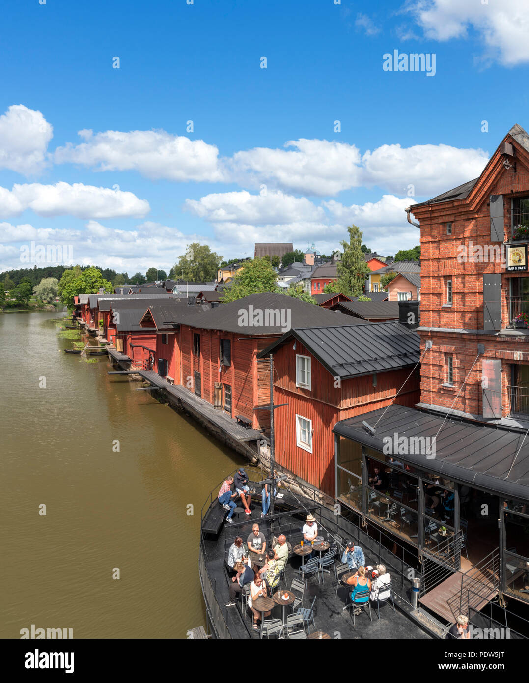 Porvoo, Finland. Historic wooden warehouses and cafe along the Porvoonjoki (Porvoo River), Old Town (Vanha Porvoo), Porvoo, Uusimaa, Finland Stock Photo