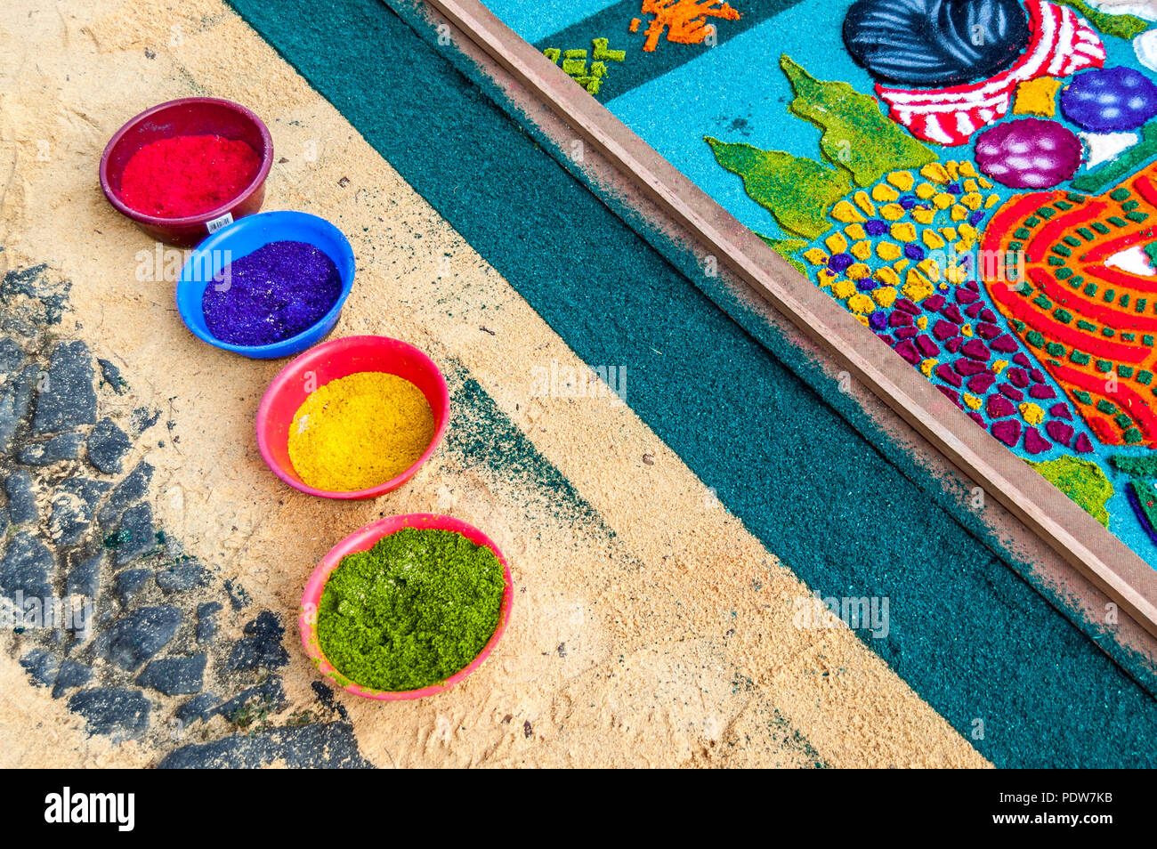 Antigua, Guatemala - April 1, 2012: Making Holy Week procession carpet in UNESCO World Heritage Site with famous Holy Week celebrations. Stock Photo