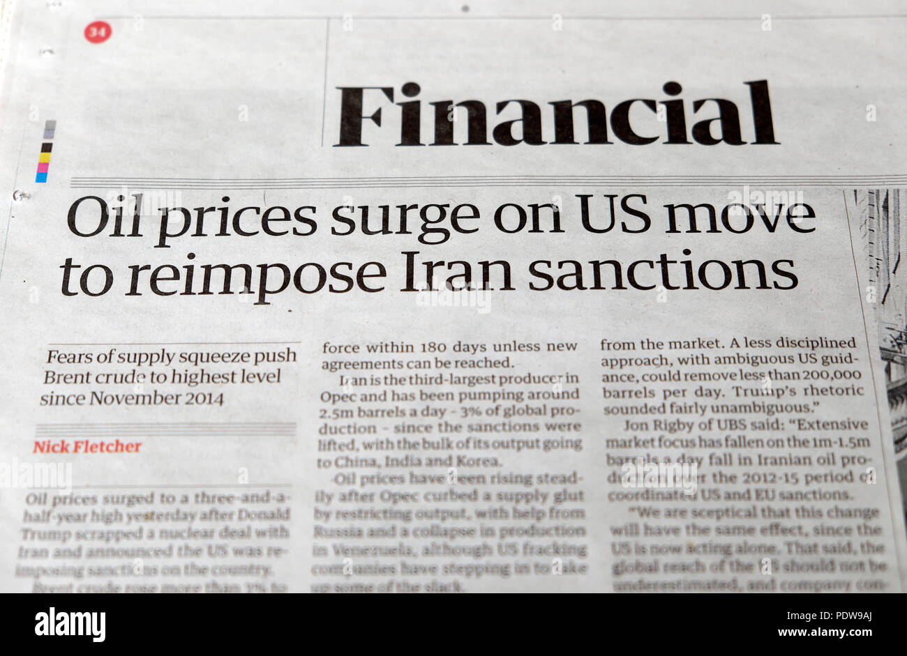 'Oil prices surge on US move to reimpose Iran sanctions'  newspaper headlines in the Financial section of the Guardian paper in London UK 2018 Stock Photo