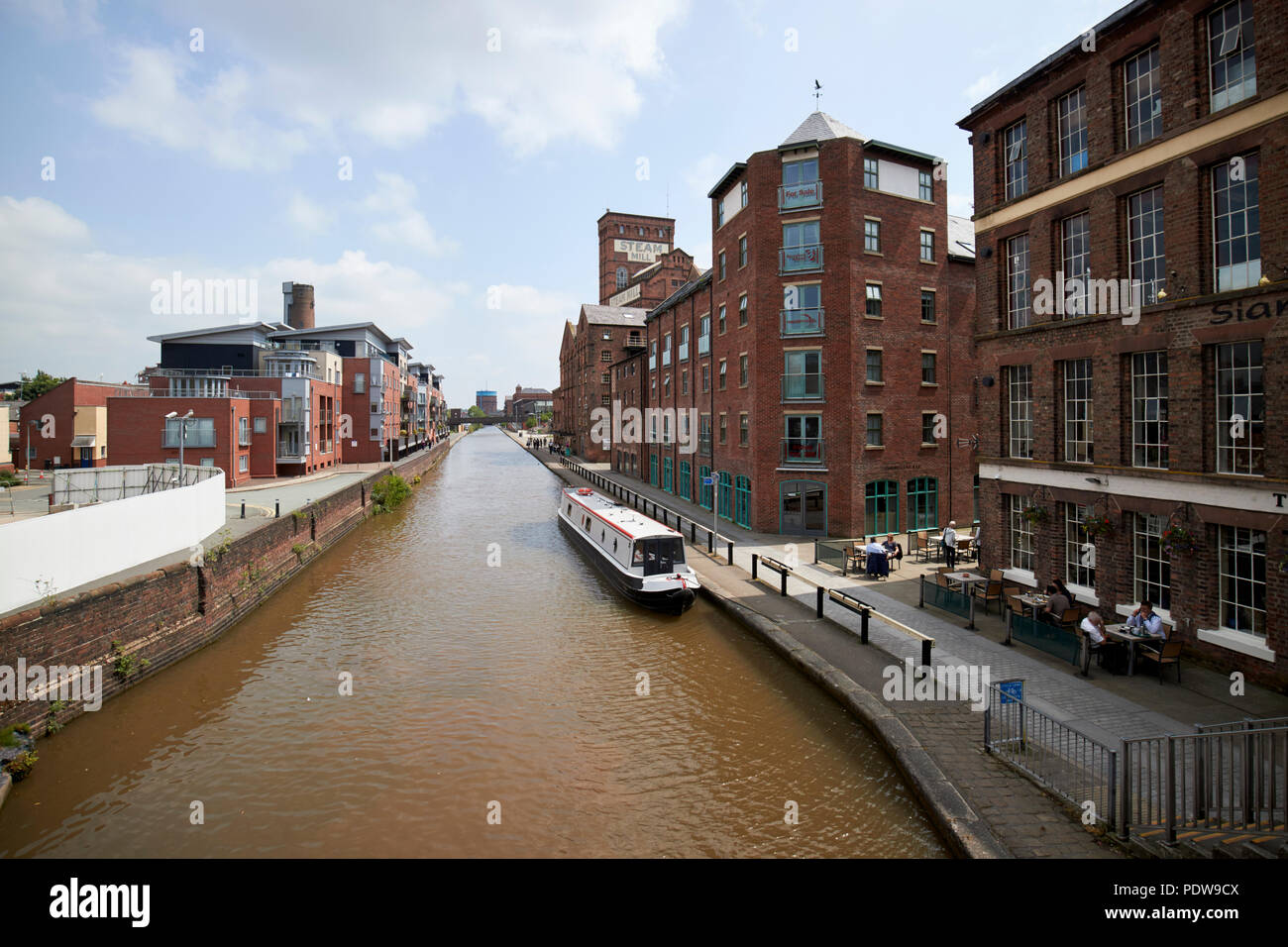 chester canal as the Shropshire union canal main line in chester passing redeveloped and repurposed old warehouses cheshire england uk Stock Photo