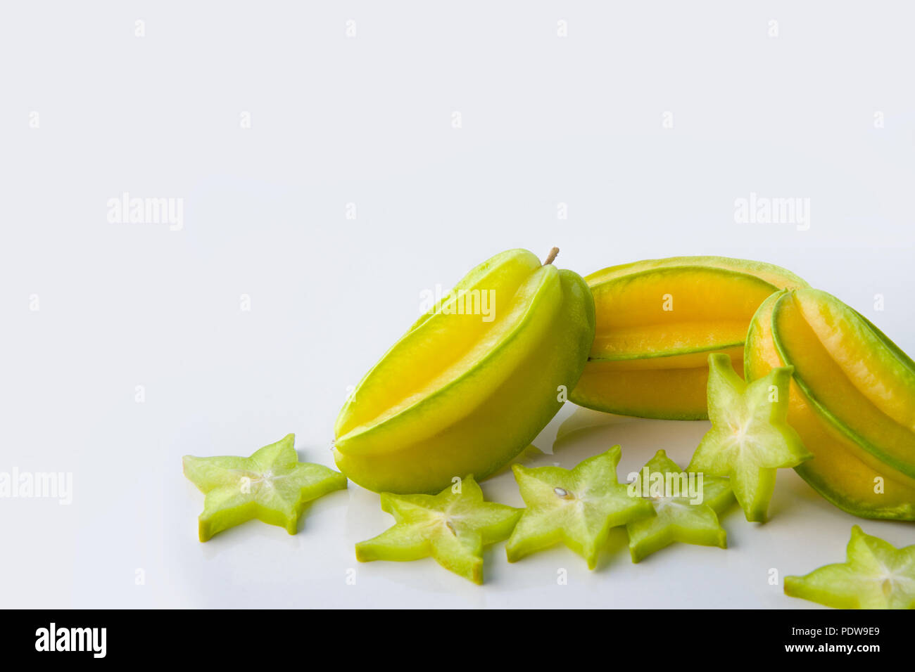 Yellow green star carambola or star apple ( starfruit ) on white background healthy star fruit food isolated Stock Photo