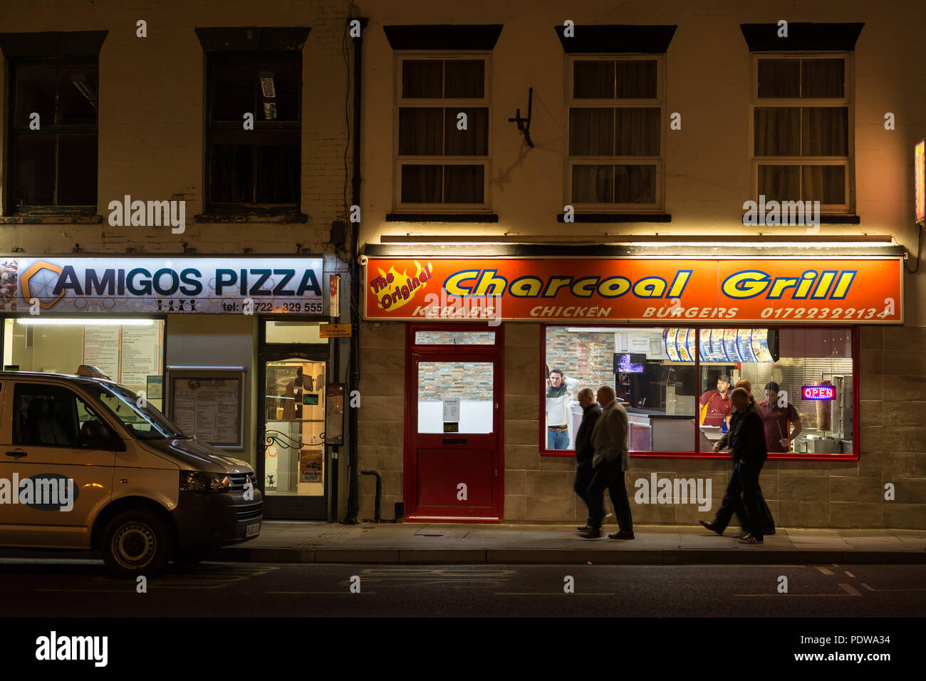 Takeaway food shops in Fisherton Street, Salisbury, Wiltshire, England at night Stock Photo
