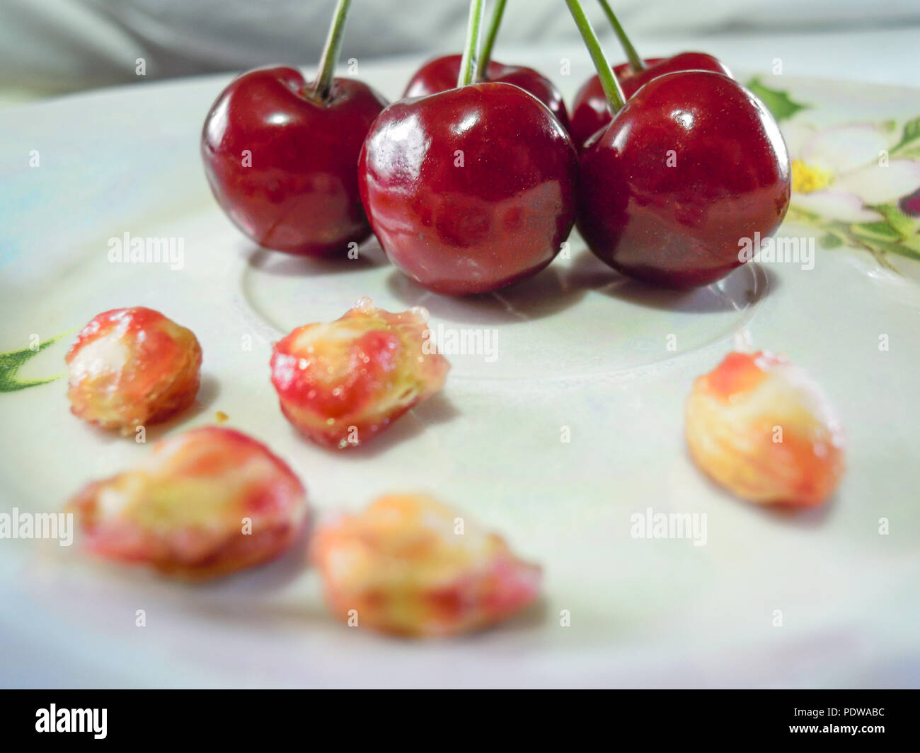 A cherry is the fruit of many plants of the genus Prunus, and is a fleshy drupe (stone fruit).  The cherry fruits of commerce usually are obtained fro Stock Photo