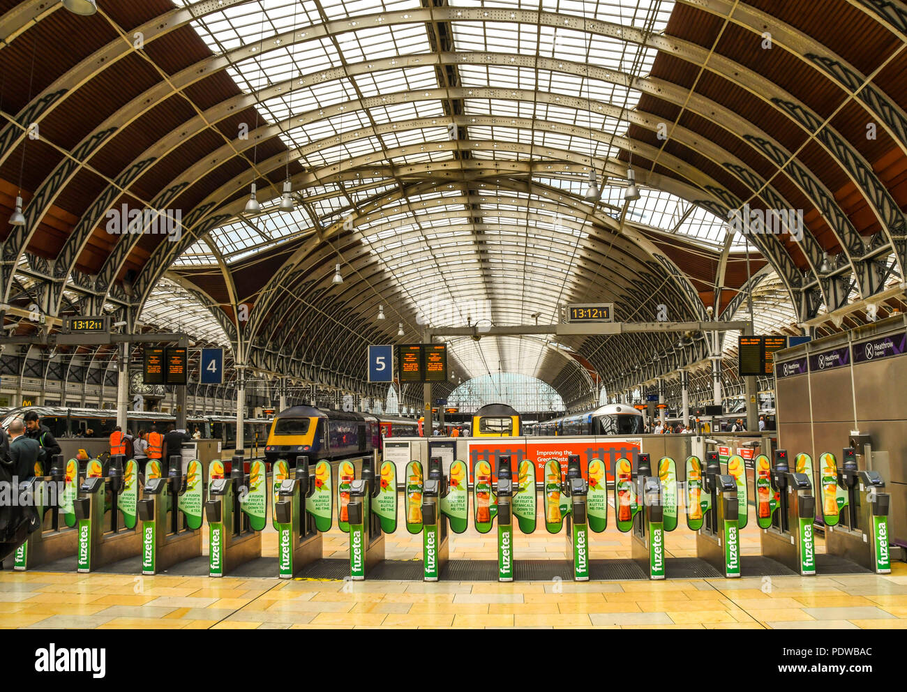 Wide angle view of automatic ticket barriers on the concourse at London