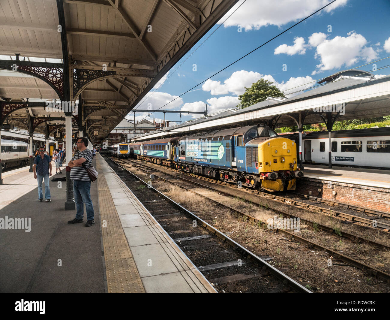 Direct Rail Services class 37 37419 'Carl Haviland' on the Norwich to Lowestoft service August 2018. The train consists of 4 coaches with a class 37 Stock Photo