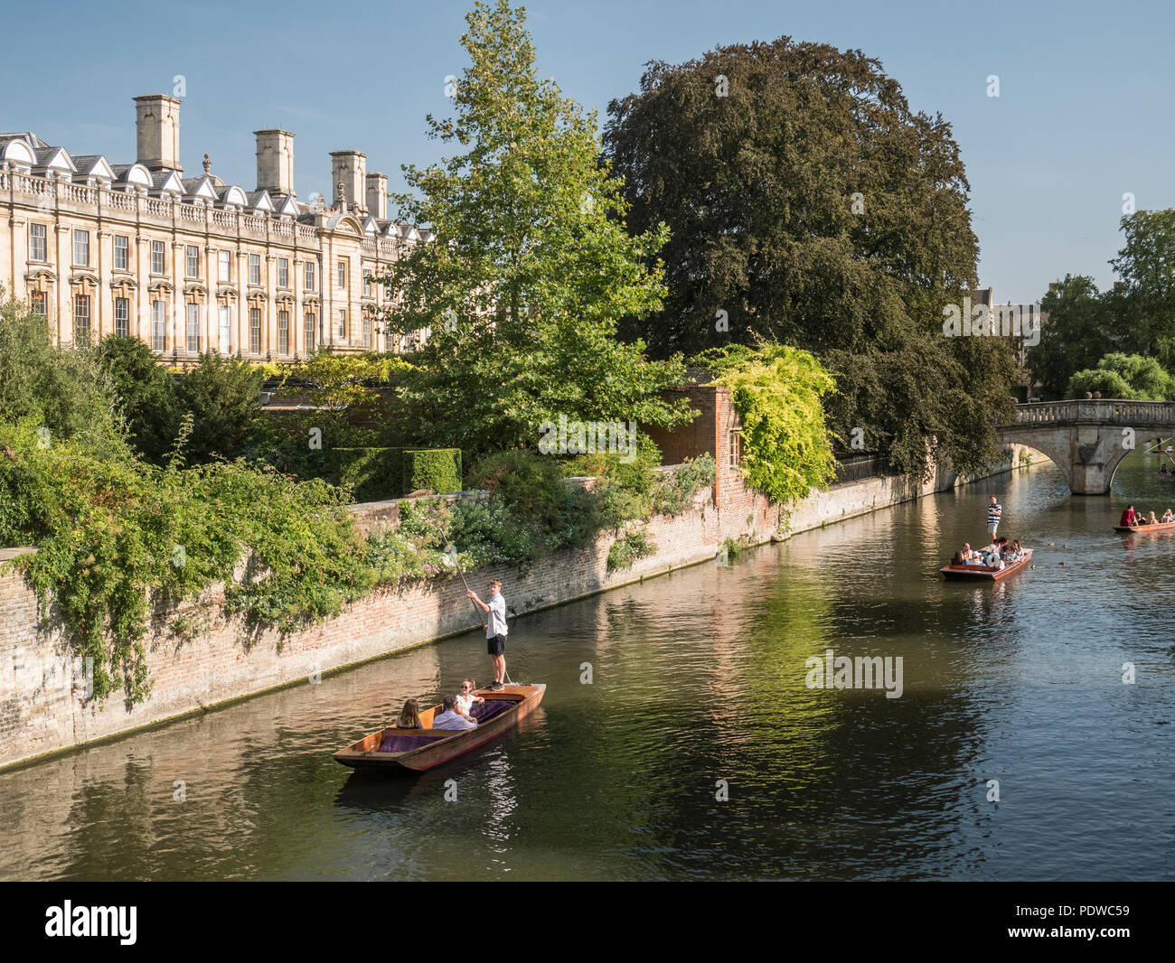 Tourists in punts in front of Clare College on the river Cam Stock Photo