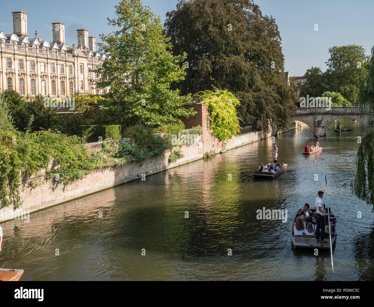 Tourists in punts in front of Clare College on the river Cam Stock Photo