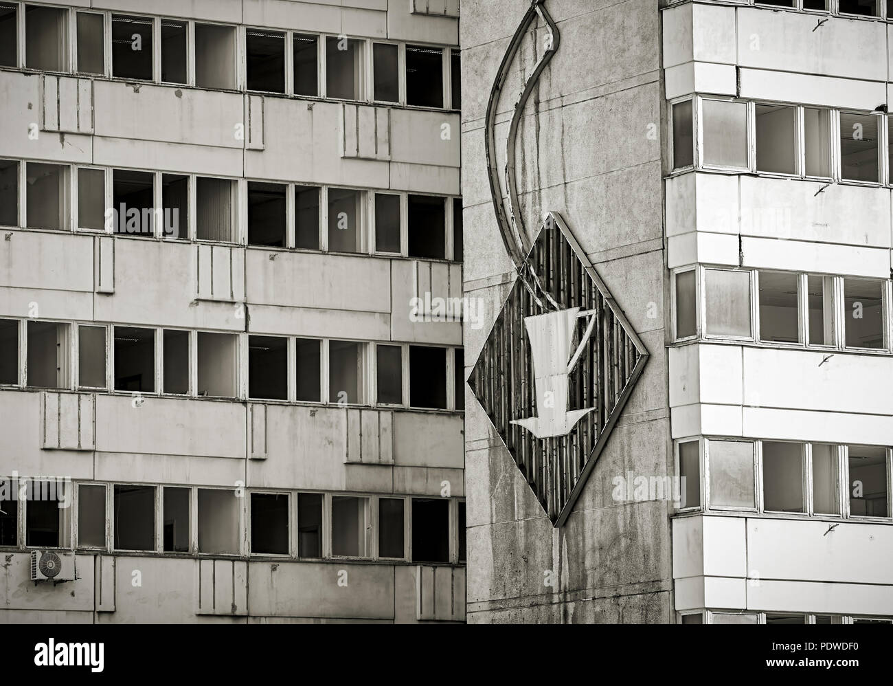 old broken GDR neon sign at an abandoned office building in Berlin Stock Photo