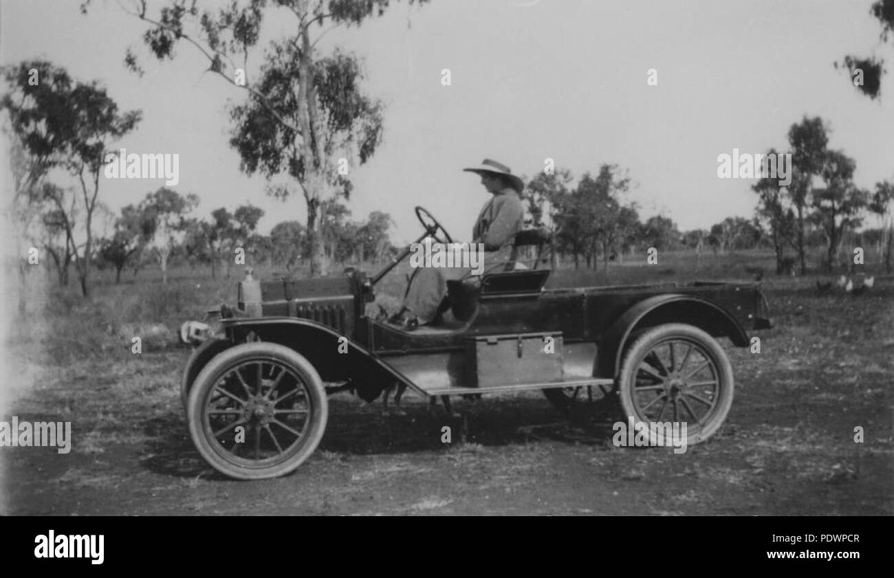 278 StateLibQld 2 101964 Jane Vary seated in a T Model Ford, Mostyndale, Springsure district, 1915 Stock Photo