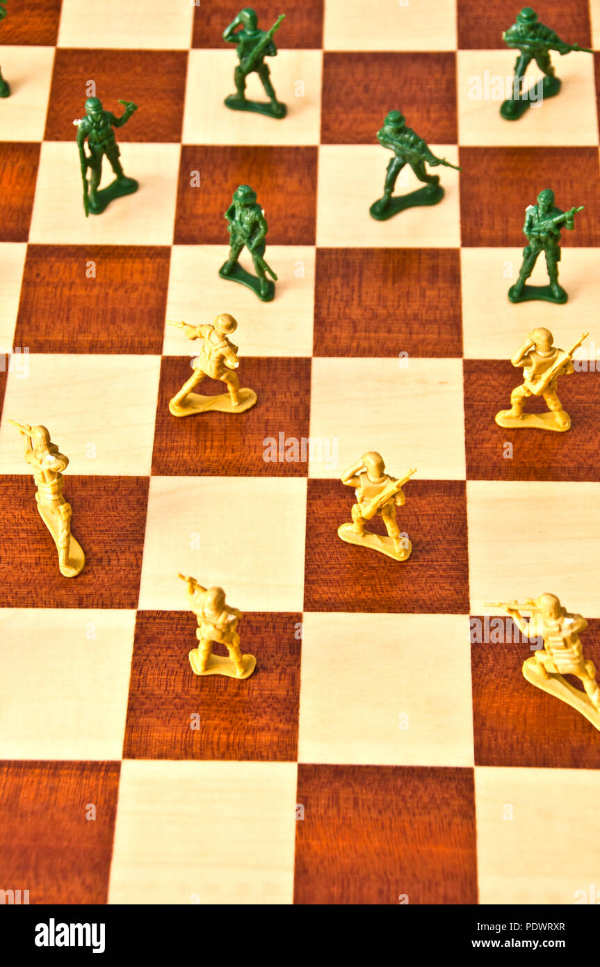 plastic toy soldiers on a chessboard Stock Photo