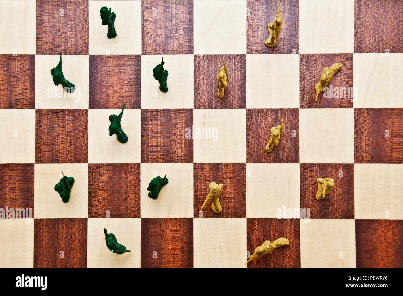 plastic toy soldiers on a chessboard Stock Photo