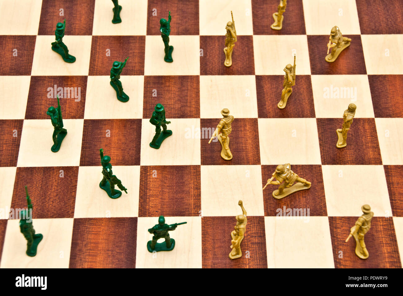 plastic toy soldiers on a chessboard Stock Photo