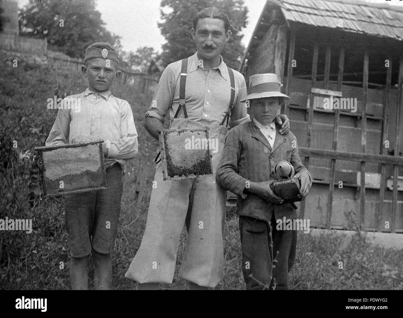 Beekeeping techniques Black and White Stock Photos & Images - Alamy