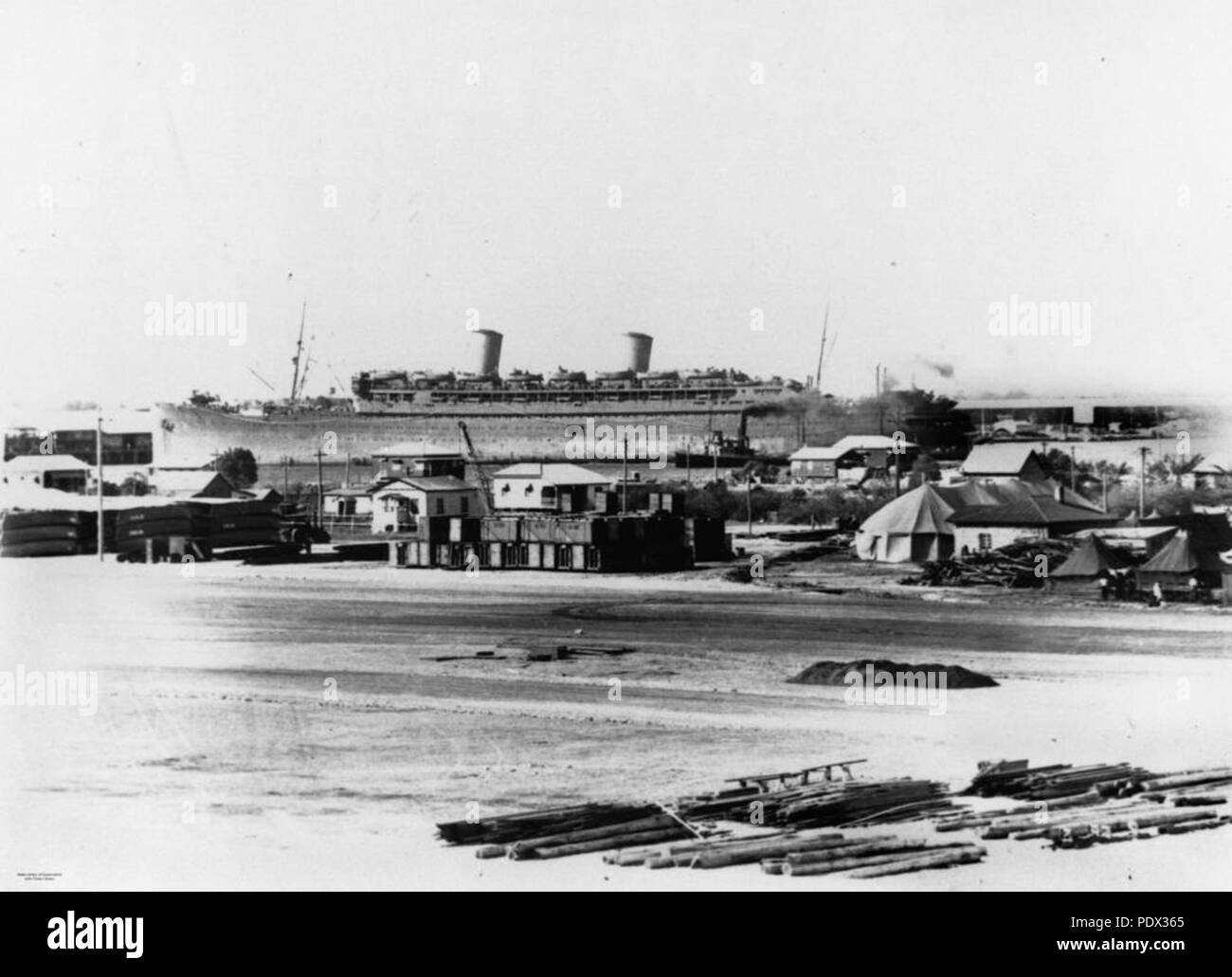246 StateLibQld 1 188183 Ship passing the U.S. Army base at Bulimba