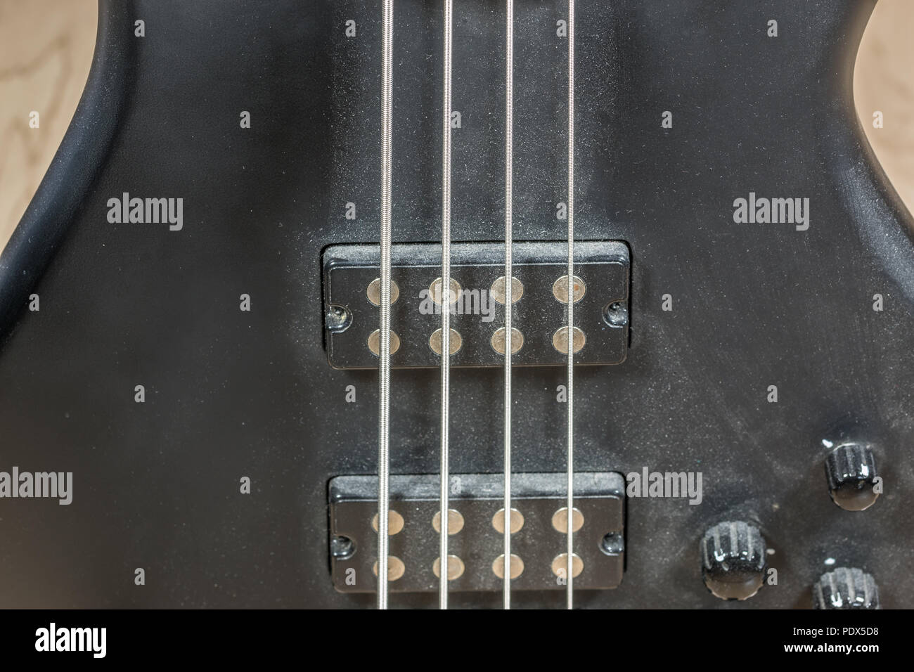 Bass guitar with four strings Stock Photo Alamy