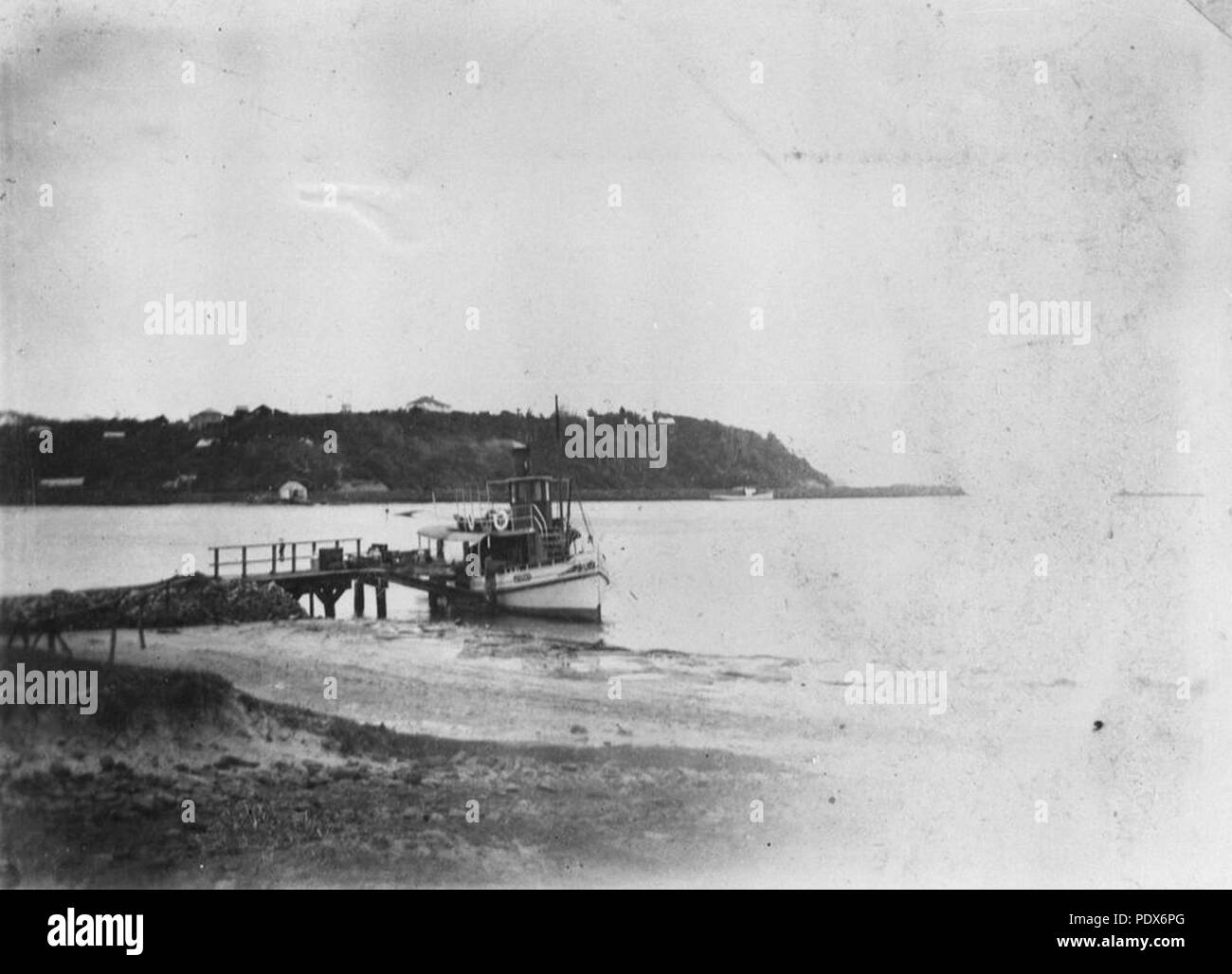 262 StateLibQld 1 295619 Boat docking at a jetty on Tweed River, 1905 ...
