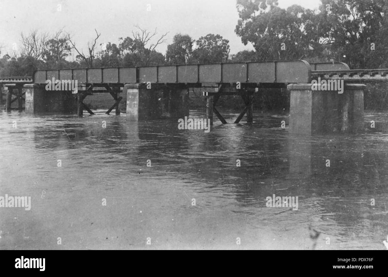 265 StateLibQld 1 40455 Floodwaters under the railway bridge at Ballandean, 1902 Stock Photo