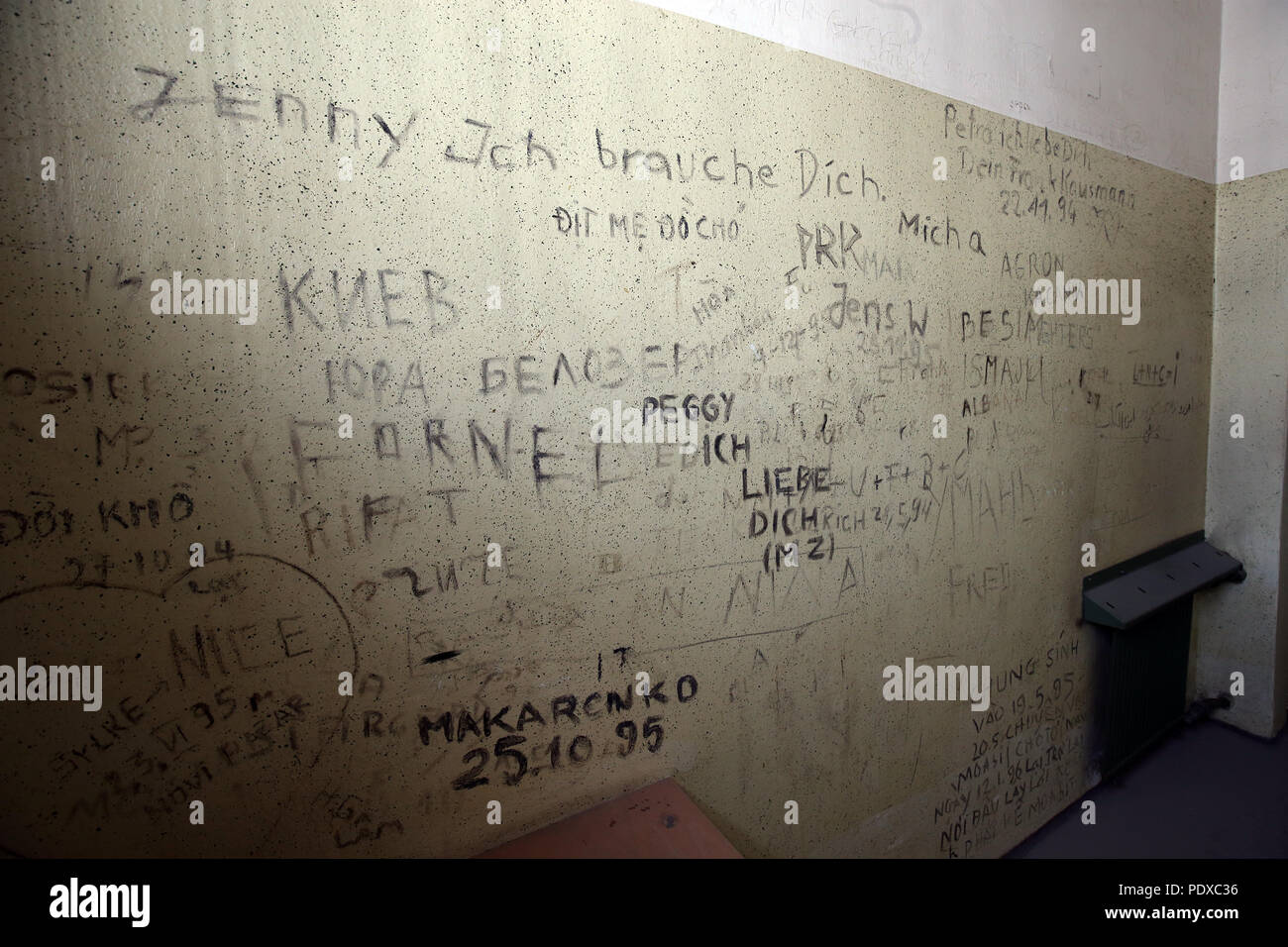 Berlin, Germany. 10th Aug, 2018. Writing covers a cell wall in a former GDR police prison on Keibelstrasse in the 'Mitte' district. The Education Administration of the Senate organized a tour for journalists through the former GDR police prison. An educational centre for students is to be built on the floors with the cell sections. Credit: Wolfgang Kumm/dpa/Alamy Live News Stock Photo