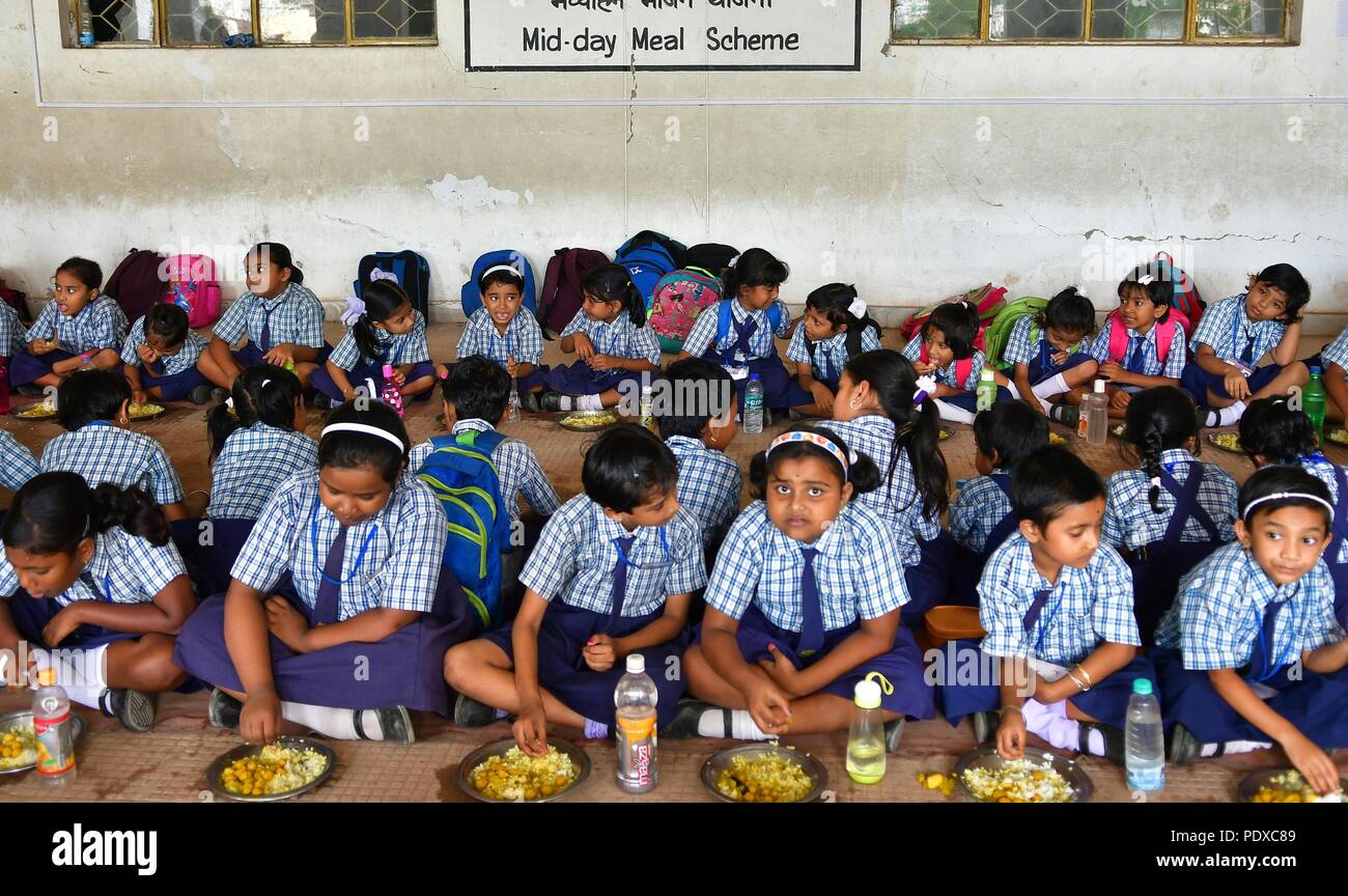 (180810) -- AGARTALA, Aug. 10, 2018 (Xinhua) -- Students eat during the Midday Meal Scheme at a school in Agartala, capital of the Northeastern state of Tripura, India, on Aug. 10, 2018. The Midday Meal Scheme is a school meal programme of the Government of India designed to improve the nutritional status of school-age children nationwide. (Xinhua/Stringer)(dh) Stock Photo