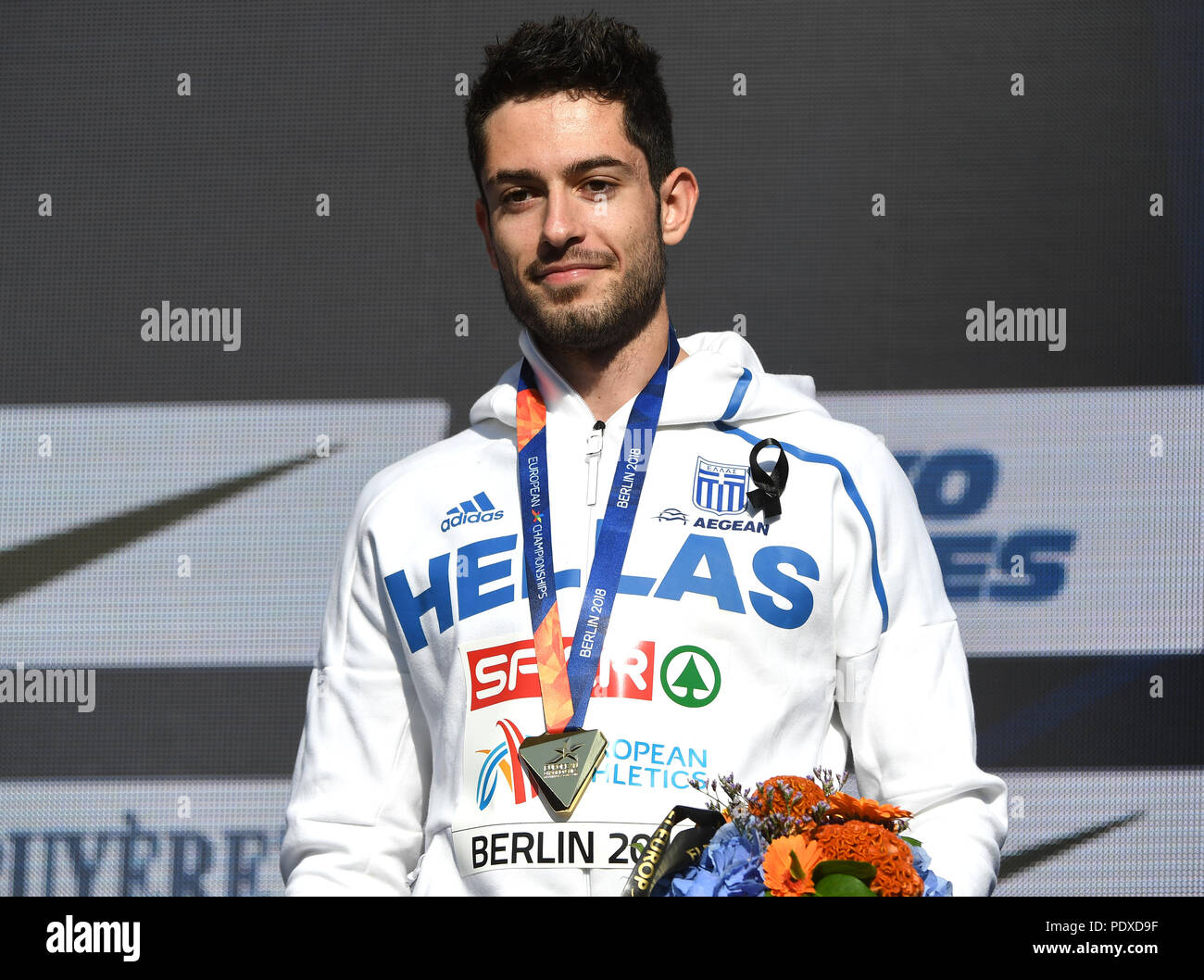 Berlin, Germany. 10th Aug, 2018. Athletics, European Championships Award  Ceremony on the European Mile at Breitscheidplatz, Long jump, Men: Gold  medal winner Miltiadis Tentoglou from Greece stands on the podium. Credit:  Hendrik