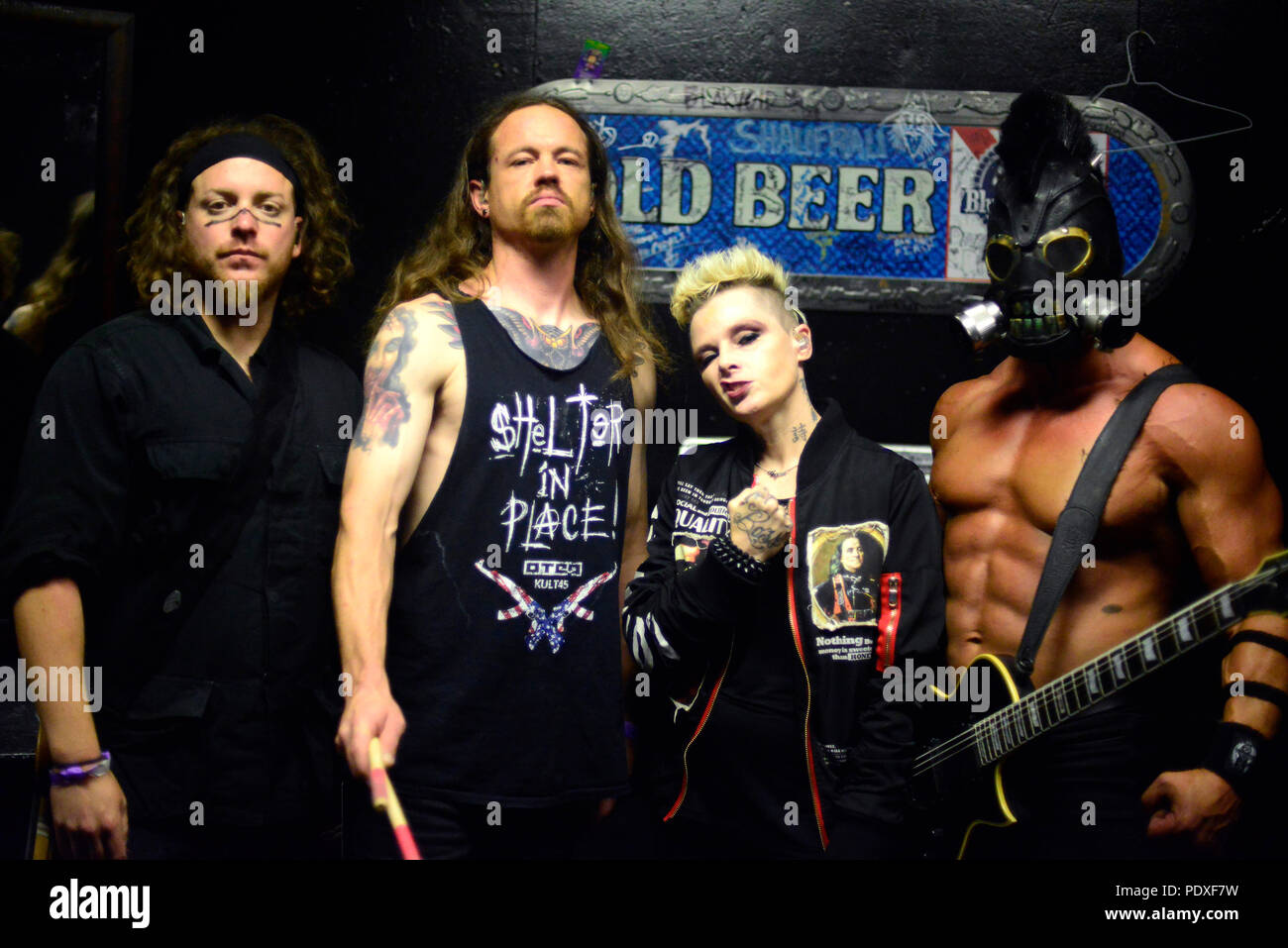 West Hollywood, CA, USA. 8th Aug, 2018. Musicians - [left to right] DREWSKI BARNES bass player, JUSTIN KIER drums, OTEP SHAMAYA lead vocals, and ''ARISTOTLE'' ARI MIHALOPOULOS guitarist for OTEP, back stage at The Whisky A Go Go, West Hollywood, California, USA, August 8, 2018. OTEP is a Los Angeles based heavy metal band that integrates rap metal, new metal, alternative metal into their sound. OTEP is an anagram for poet. Otep Shamaya descibes the bands sound as, ''art house nu-metal.'' .Image Credit cr Scott Mitchell/ZUMA Press Credit: Scott Mitchell/ZUMA Wire/Alamy Live News Stock Photo