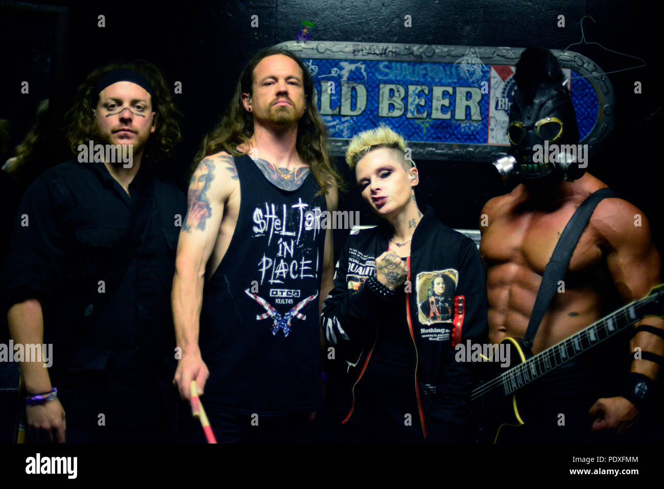 August 8, 2018 - West Hollywood, CA, USA - Musicians -  [left to right]  DREWSKI BARNES bass player, JUSTIN KIER drums, OTEP SHAMAYA lead vocals, and ARISTOTLE-ARI MIHALOPOULOS on guitars for OTEP, back stage at The Whisky A Go Go, West Hollywood, California, USA, August 8, 2018. OTEP is a Los Angeles based heavy metal band that integrates rap metal, new metal, alternative metal into their sound.  OTEP is an anagram for poet.  Otep Shamaya descibes the bands sound as, ''art house nu-metal.''  ..Image Credit  cr  Scott Mitchell/ZUMA Press (Credit Image: © Scott Mitchell via ZUMA Wire) Stock Photo