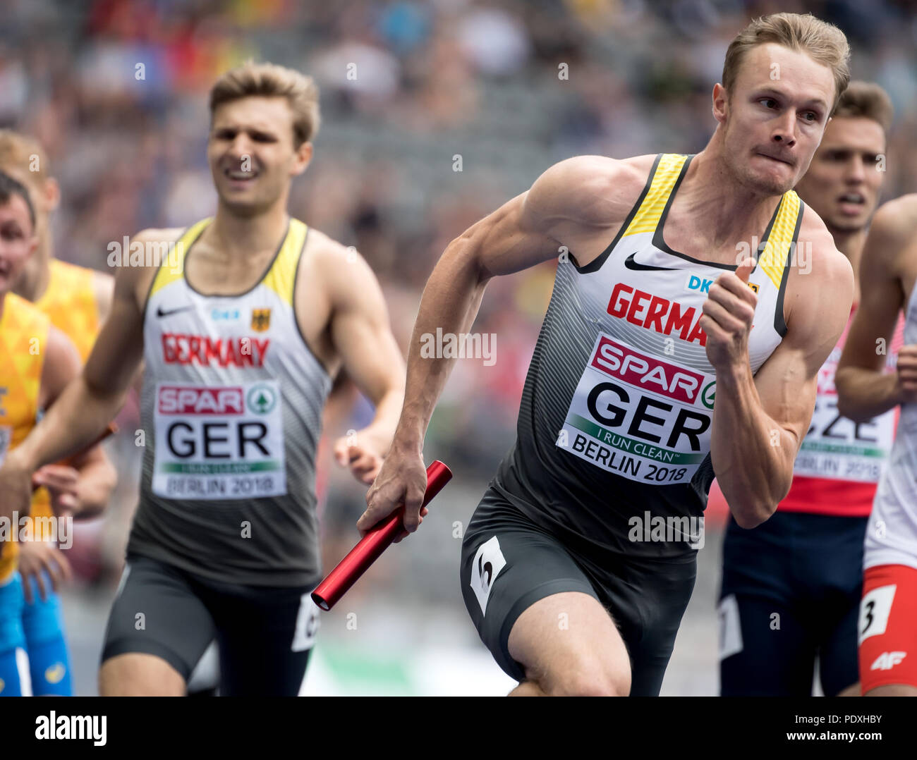 Berlin, Germany. 10th Aug, 2018. European Athletics Championships at the Olympic Stadium: 4x400 Meter Relay, Men, Round 1: Fabian Dammer (L) passes the baton to Johannes Trefz from Germany. Credit: Action Plus Sports/Alamy Live News Stock Photo